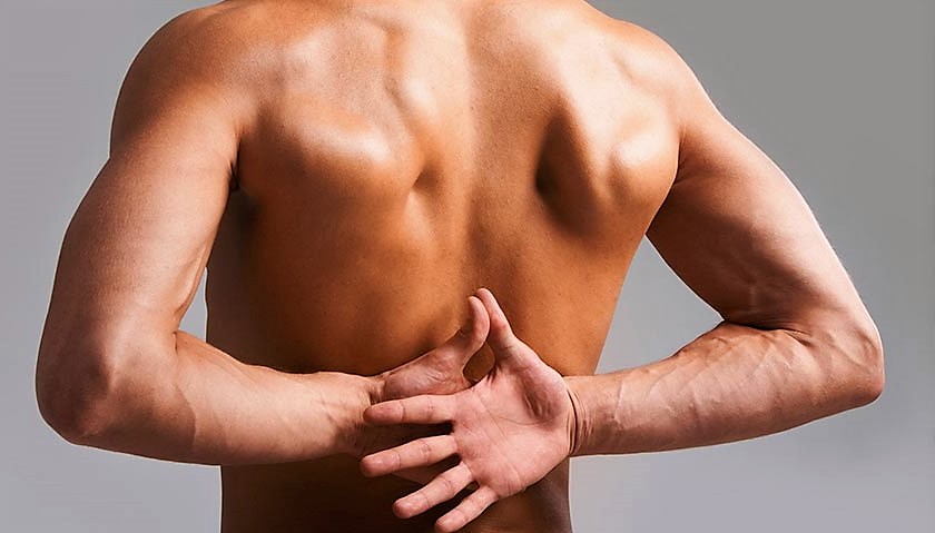 Чому виникає біль у спині?